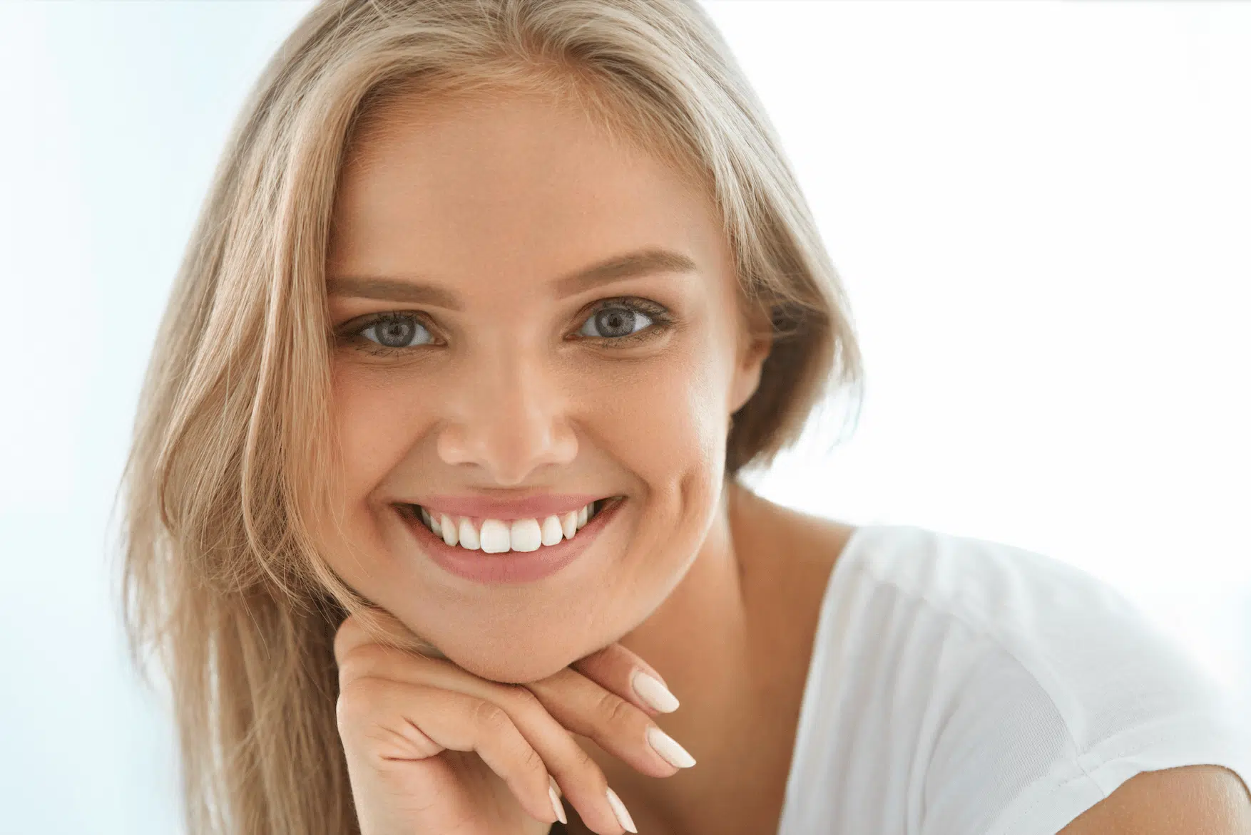 woman after cosmetic dentistry procedure by Burleigh Dental Studio