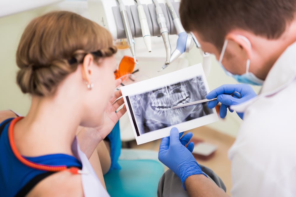 Dentist Showing Teeth X-Ray Dentist Showing Teeth X-Ray